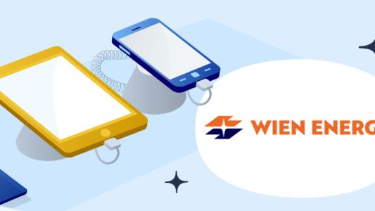 Laoptop, Handy und Tablet neben dem Wien Energie Logo