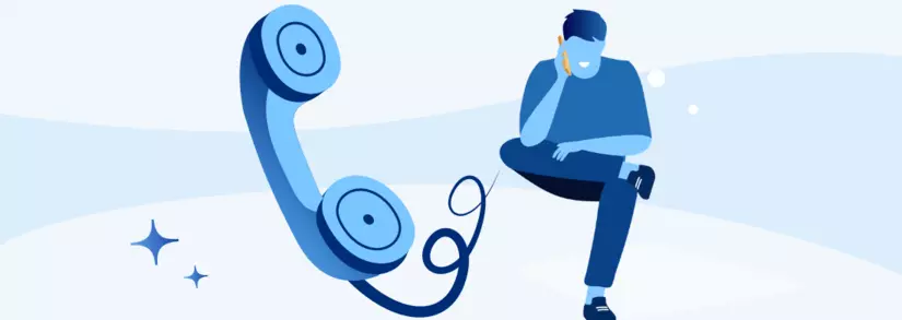 Mann telefoniert mit blauem Festnetztelefon